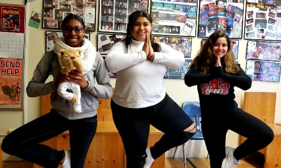 Students practicing yoga